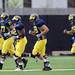 Michigan football players move to a different section of the practice field during practice on Tuesday.  Melanie Maxwell I AnnArbor.com
